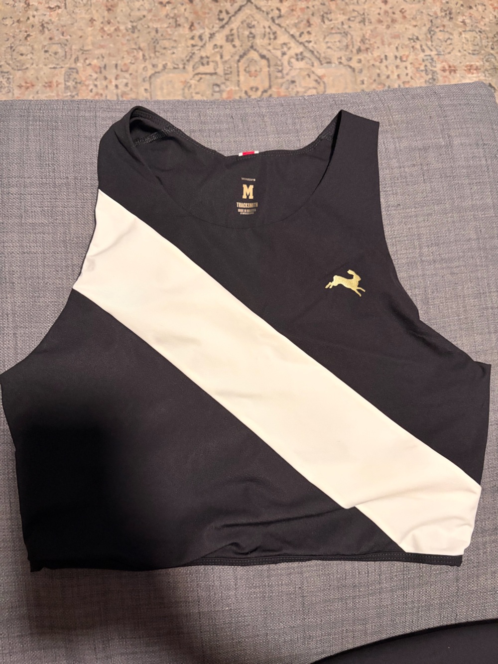 Tracksmith Bell Lap Top - Black with Cream White Diagonal Stripe and Gold logo